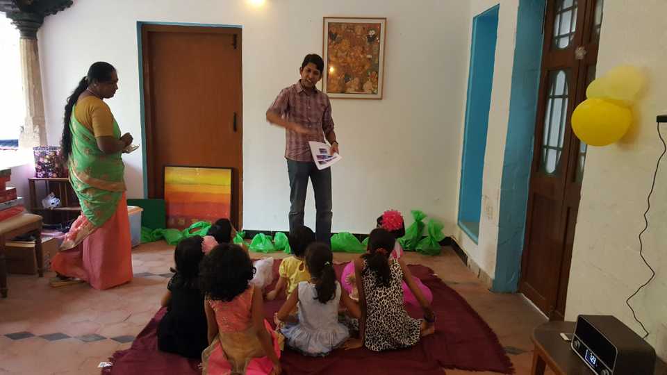 Aravind briefing the kids to start the Lego Assembly activity