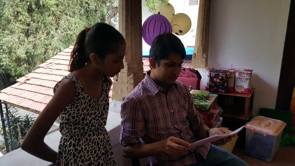 Aravind briefing the oldest kid to help and supervise the Lego Assembly activity