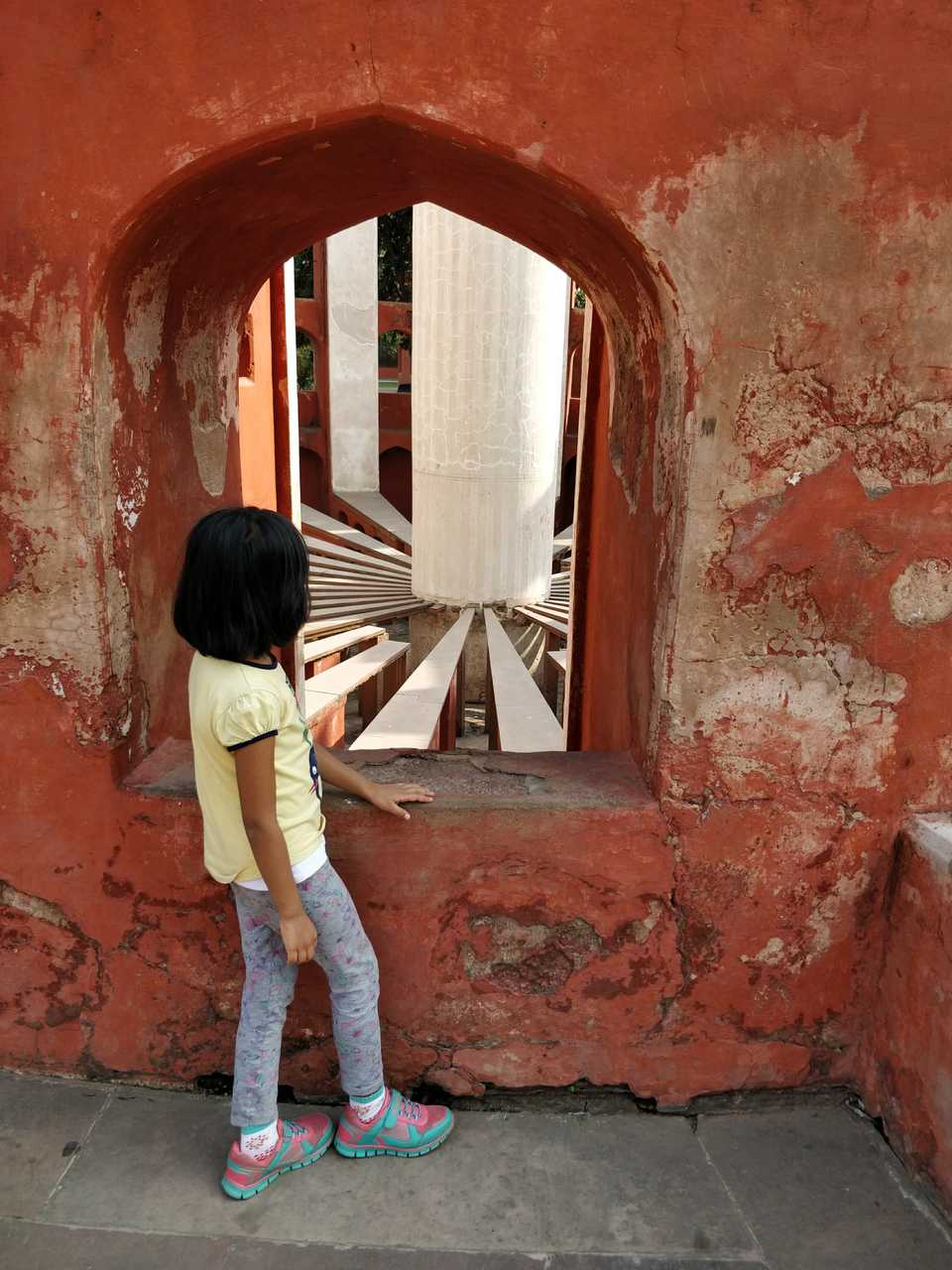 Laasya looking at a Jantar Mantar instrument